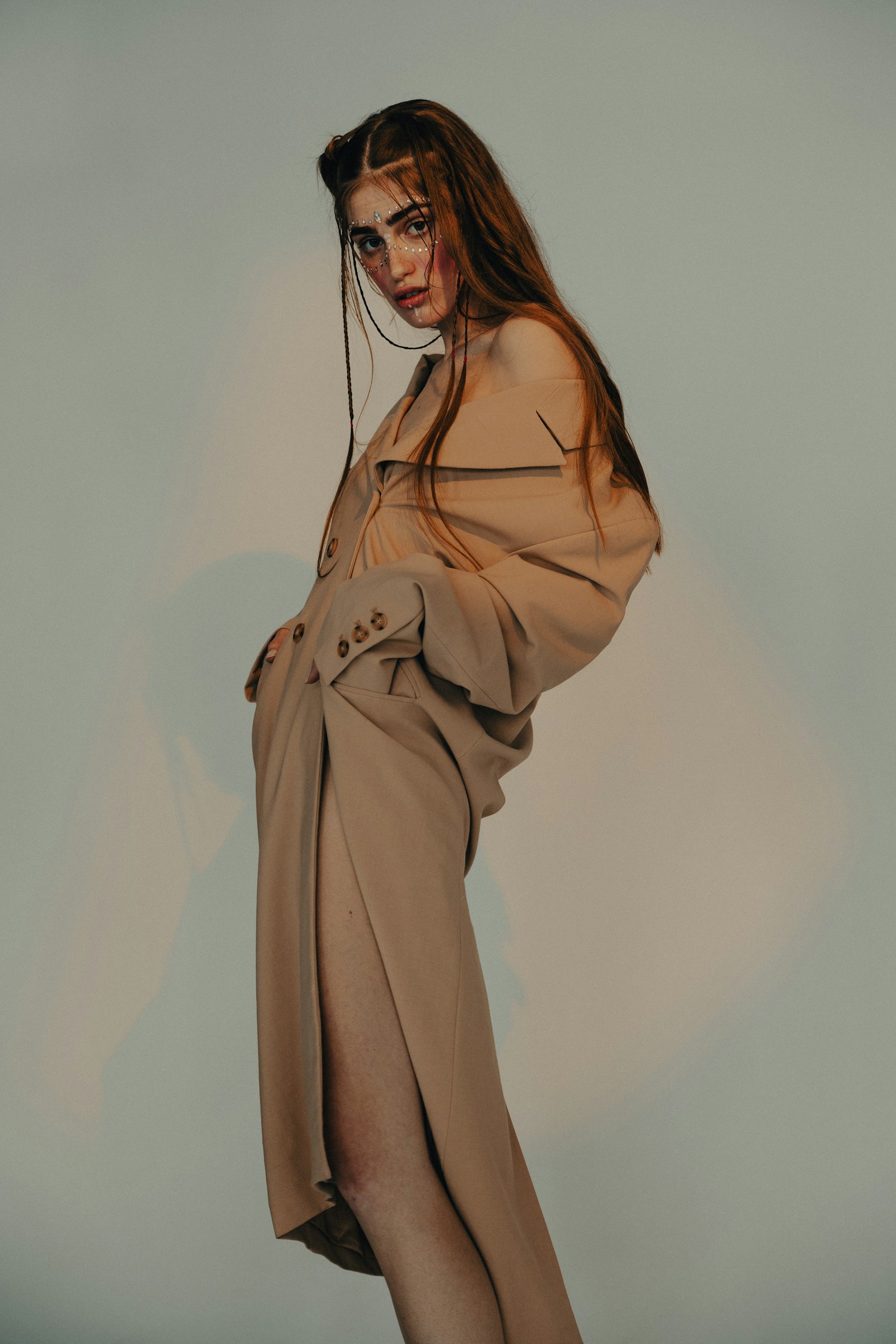 Model in an oversized camel trench